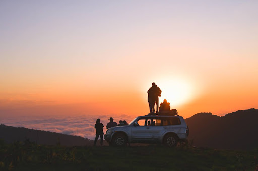 Friends completing a sunrise off-roading excursion.