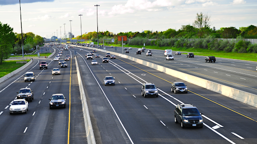 A multilane highway with moderate traffic.