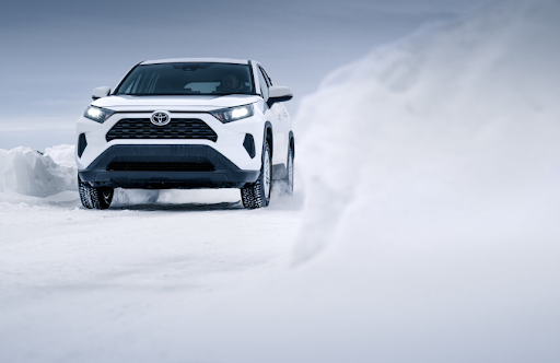 A white car on a snowy terrain - Sailun Tires