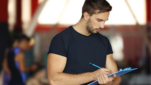 Man looks at clipboard