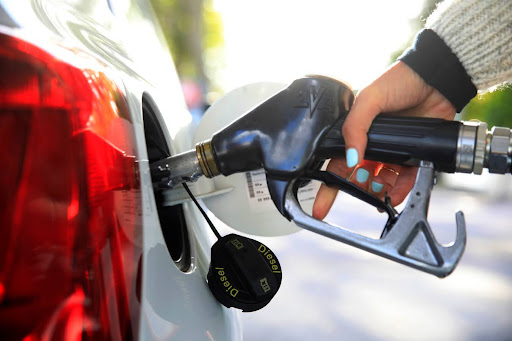 Fuel efficient car at gas pump