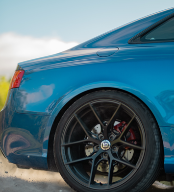 The bumper of a blue car - Sailun Tires