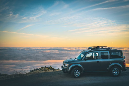 a parked vehicle overlooking a valley