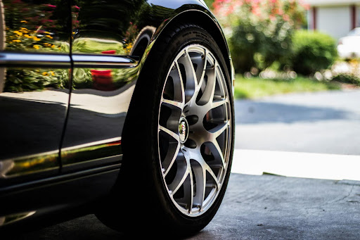 a close-up of a tire on a black car