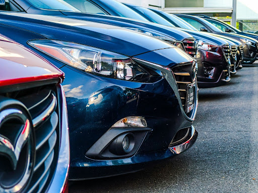 a line-up of vehicle bumpers in a lot